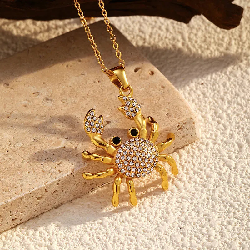 Gold electroplated stainless steel crab pendant necklace with diamond accents on regular chain, natural style