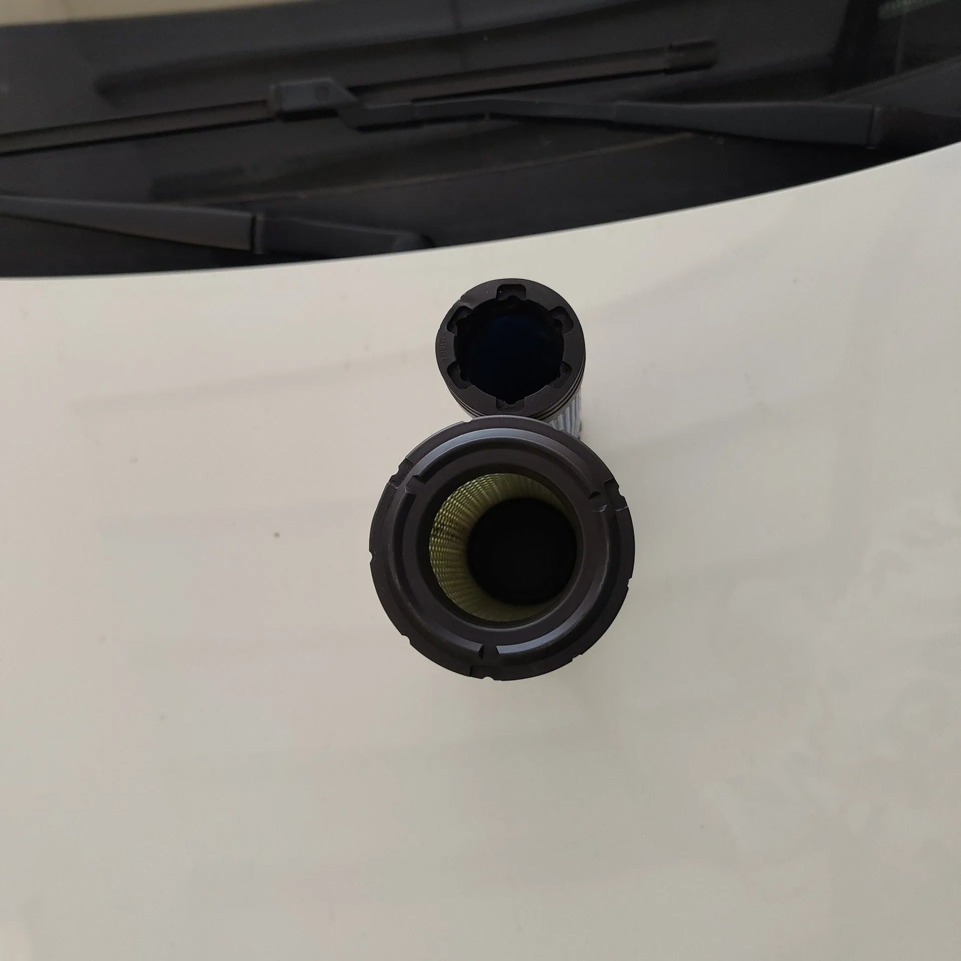 Donaldson 1027 straight head air filter with G057513 elbow, showing large circular filter element.