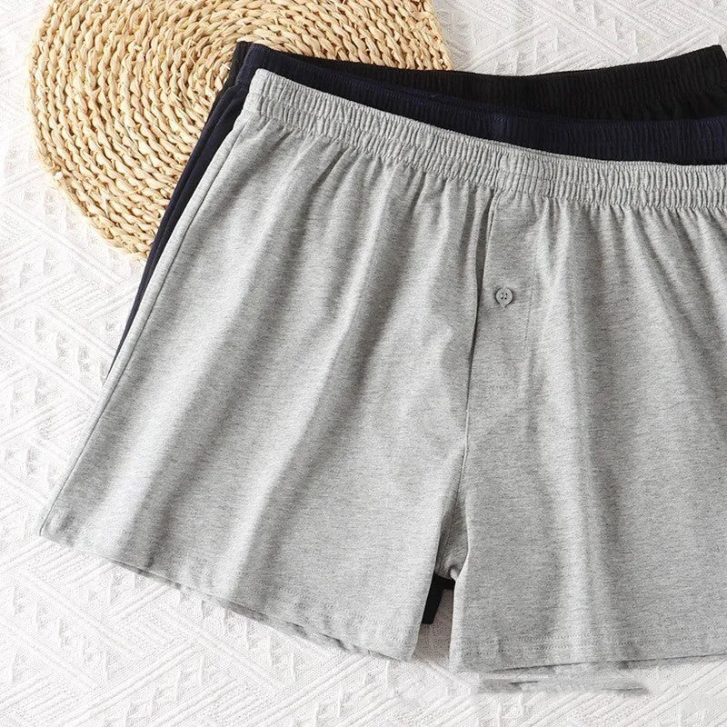 Men's black cotton loose boxer shorts with a high waist on a white background