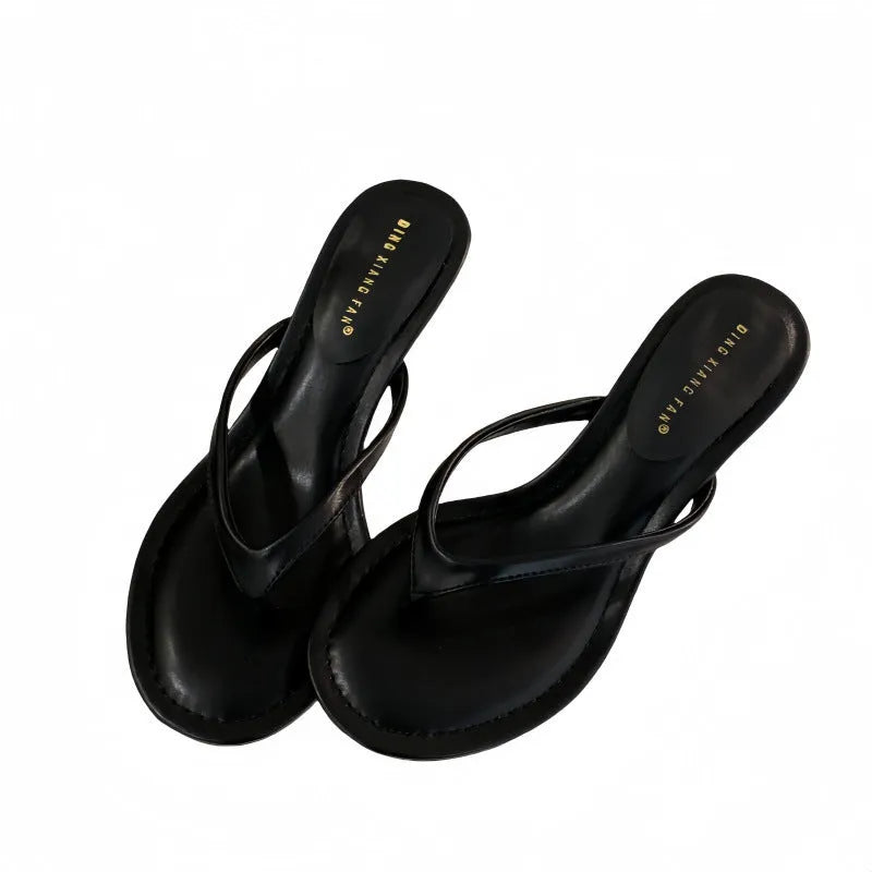 Women's open-toed stiletto sandals with round toe in rubber material, available in sheepskin camel and black