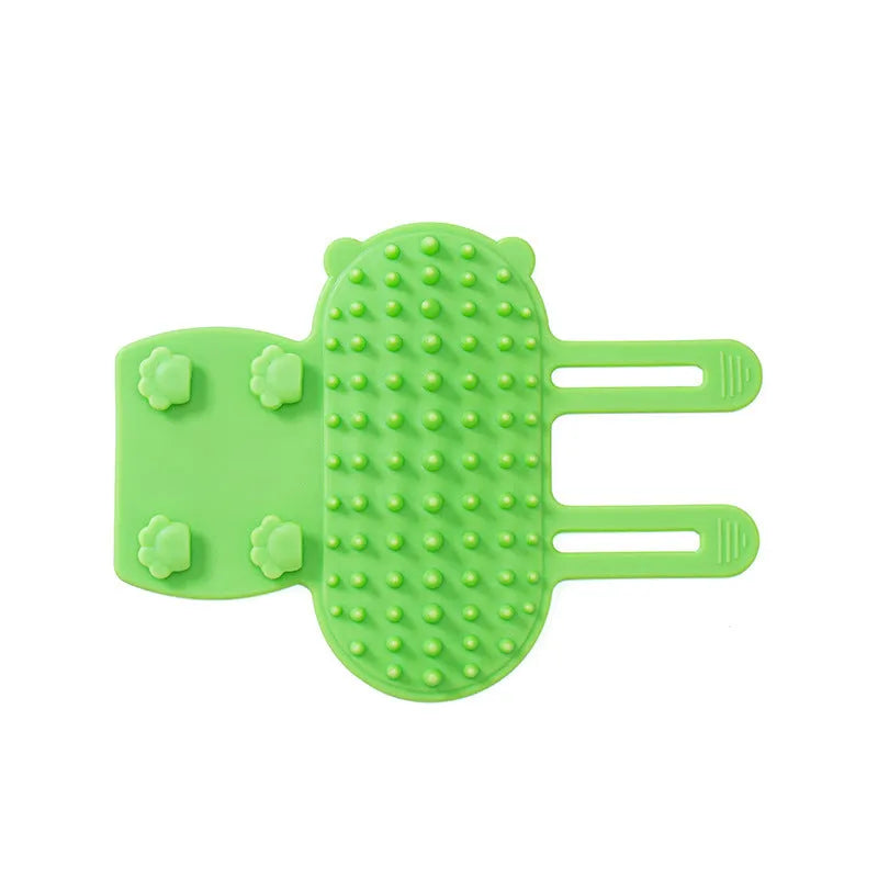 Silicone cat grooming brush with comb teeth mounted on table leg for scratching and hair removal