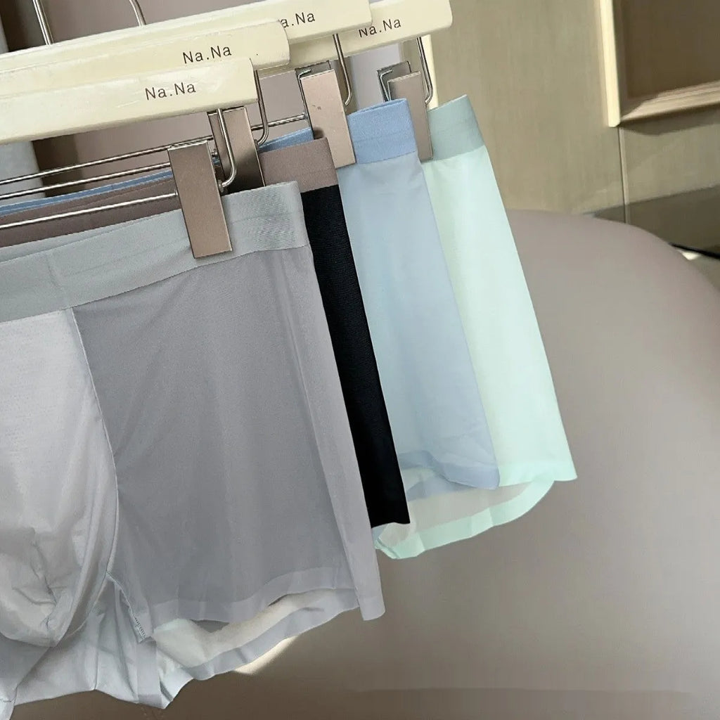 Seamless ice silk men's boxers in a solid colour on a mid-waist mannequin, showing honeycomb crotch detail.