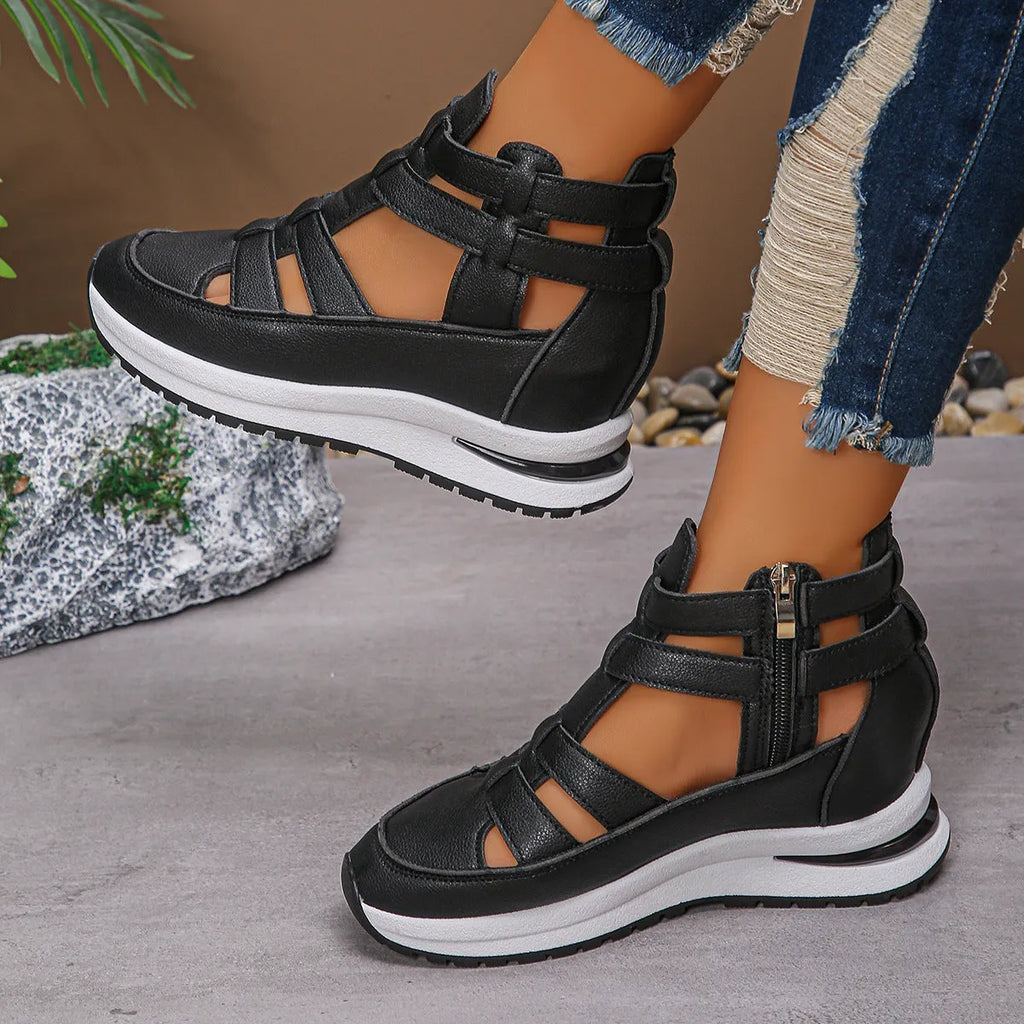 Women's black platform sandals with hollow-out design and Velcro strap.