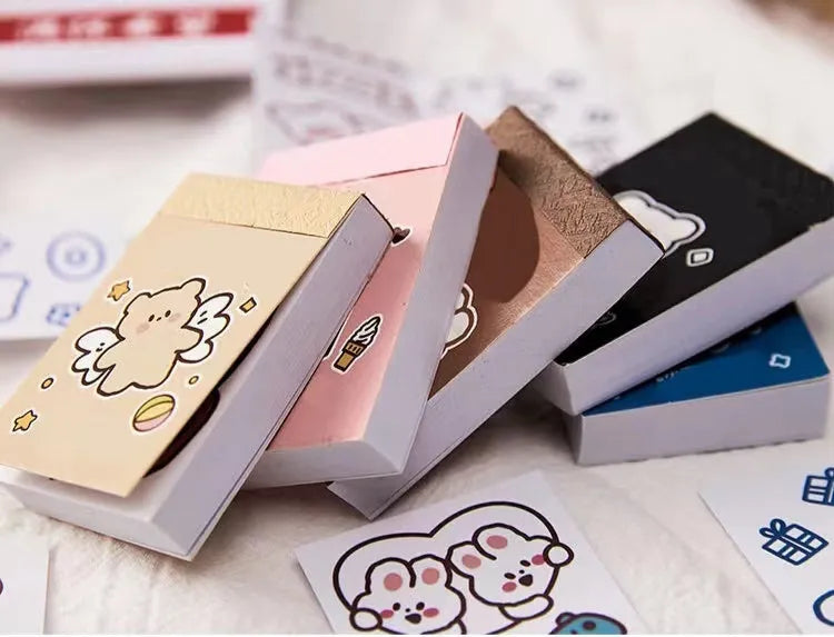 Fifty decorative sticker sheets in Japanese composite paper with cute animal and beverage designs measuring 40x60mm each