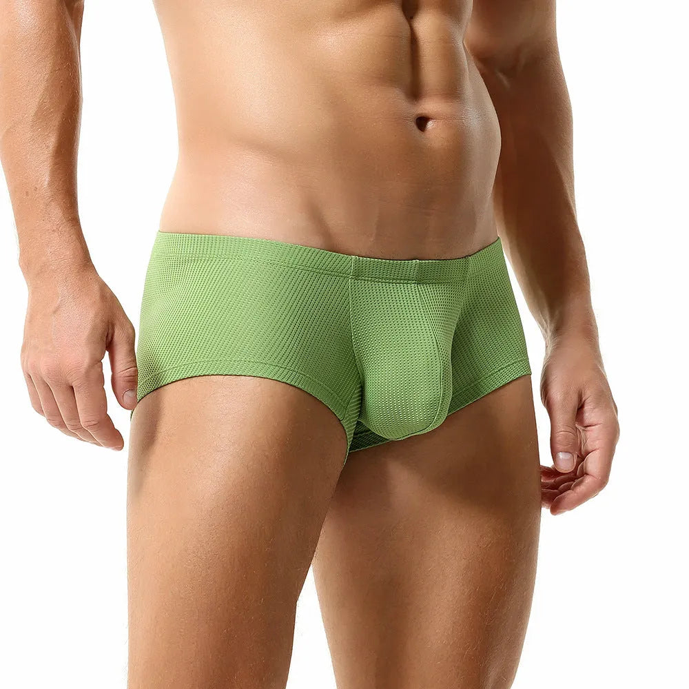 Men's solid colour nylon boxers with a mid-low waist, shown in orange, blue, green, light blue, and white.