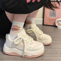 Women's green platform sneakers with patent leather finish, round toe, and lace-up front