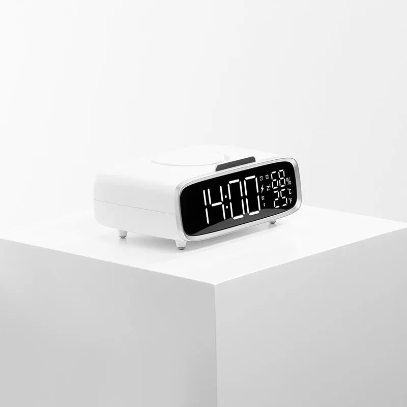 White wireless charging Bluetooth speaker alarm clock with night light on bedside table