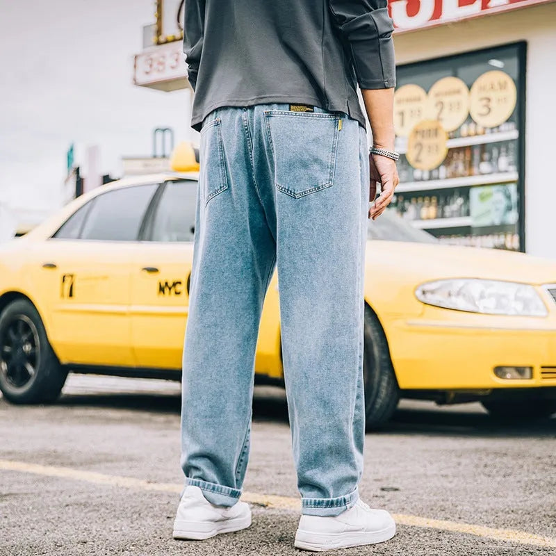 Men's loose straight simple jeans in dark blue cotton with mid waist and zipper fly available in plus sizes