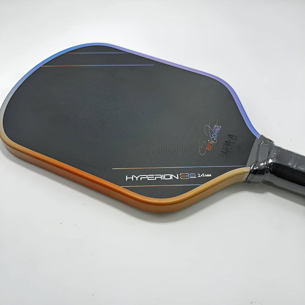 Multicolour matte finish pickleball racket with T700 carbon fibre frame and honeycomb core.