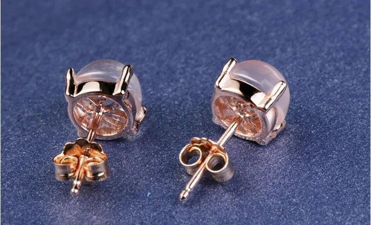 Women's rose gold Korean style stud earrings with synthetic ross quartz crystal inlay in drop shape