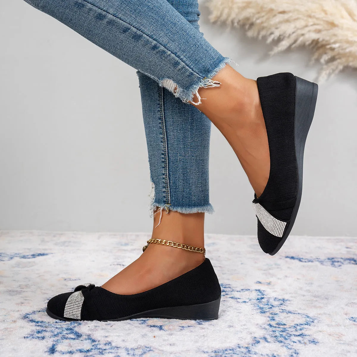 Women's black casual slip-on shoes with rhinestone detail, round toe, and a chunky heel.