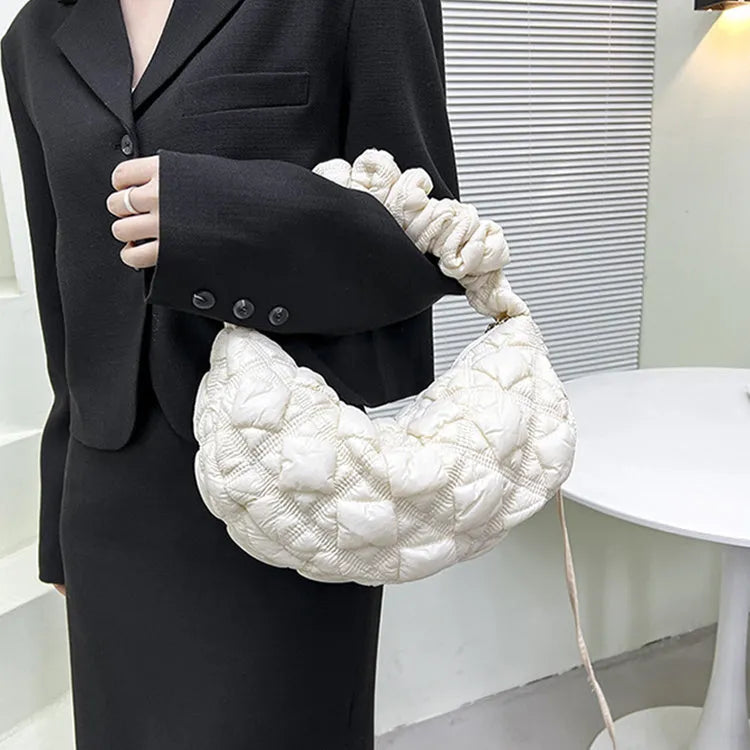 Women's lightweight nylon underarm messenger bag in a solid colour with an adjustable long shoulder strap.