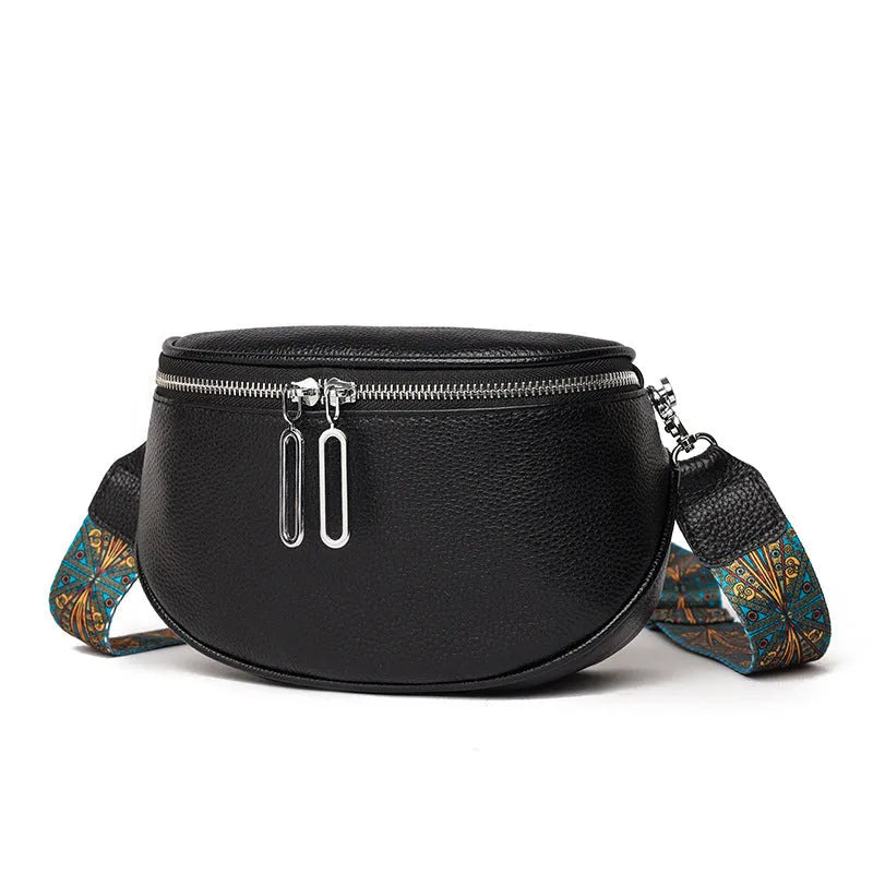 Soft black PU women's saddle-shaped messenger bag with a single crossbody strap and external pocket.