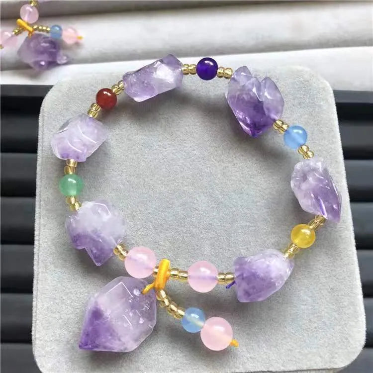 Natural purple amethyst bead bracelet for women with a silver Fu character charm.
