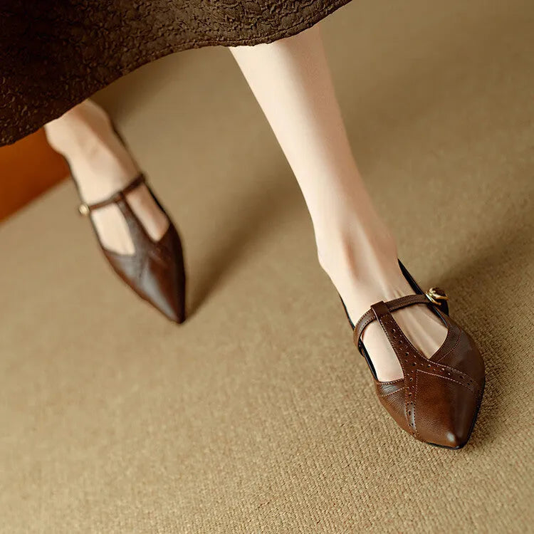 Brown pointed low-cut flat shoes with cowhide leather upper and metal decorative details