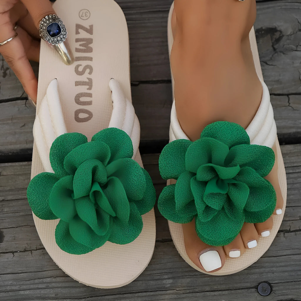 Plus size floral flip flop slippers in beige, green, and rose red on a white background.