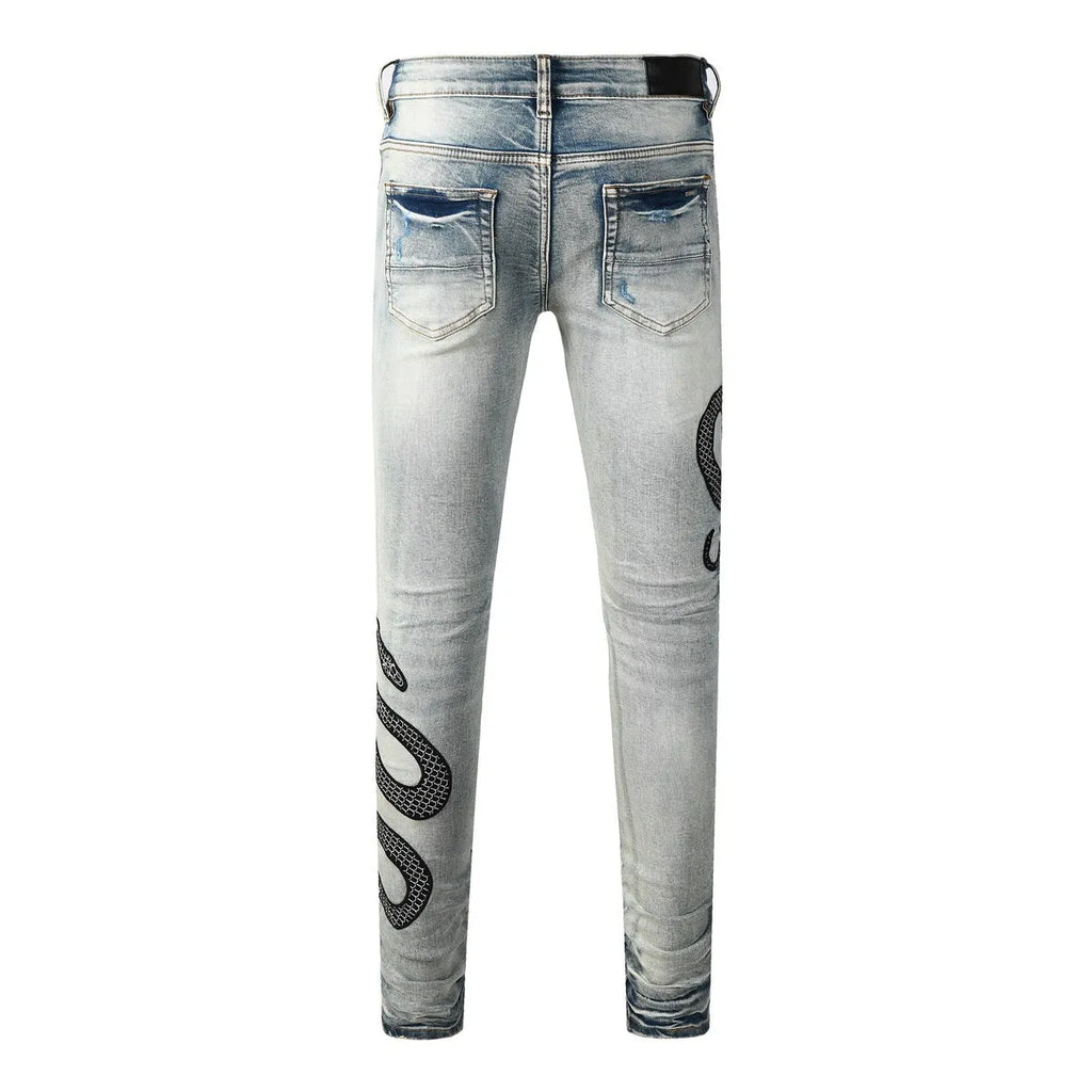 Distressed skinny jeans in mid-wash blue with street fashion styling and micro elasticity cotton fabric