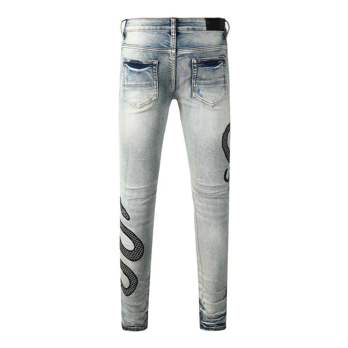 Distressed skinny jeans in mid-wash blue with street fashion styling and micro elasticity cotton fabric