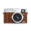Black or brown 5K digital camera with front and rear lenses, optical viewfinder, and 2.88-inch screen