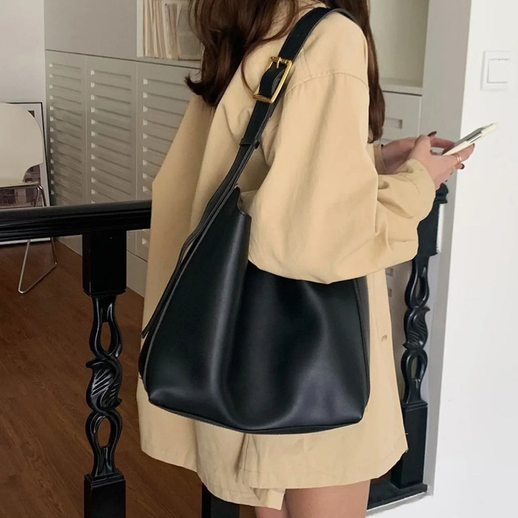 Women's soft PU leather shoulder bag with swing threads in black ribbon and brown with packet styles