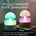 White cloud-shaped humidifier with LED lights and simulated rainfall, includes remote control