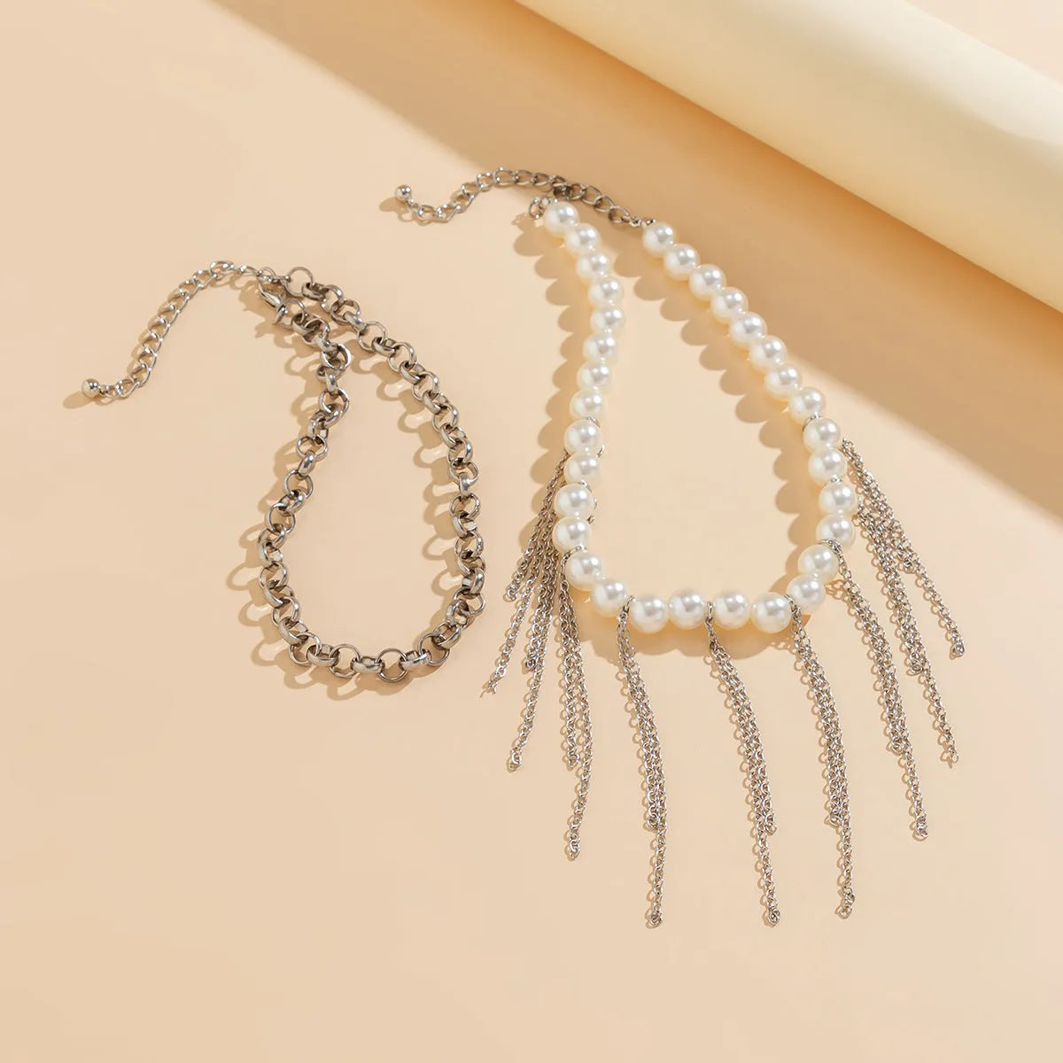 Double-layer imitation pearl tassel necklace with iron pendant and ball bead chain in white K colour
