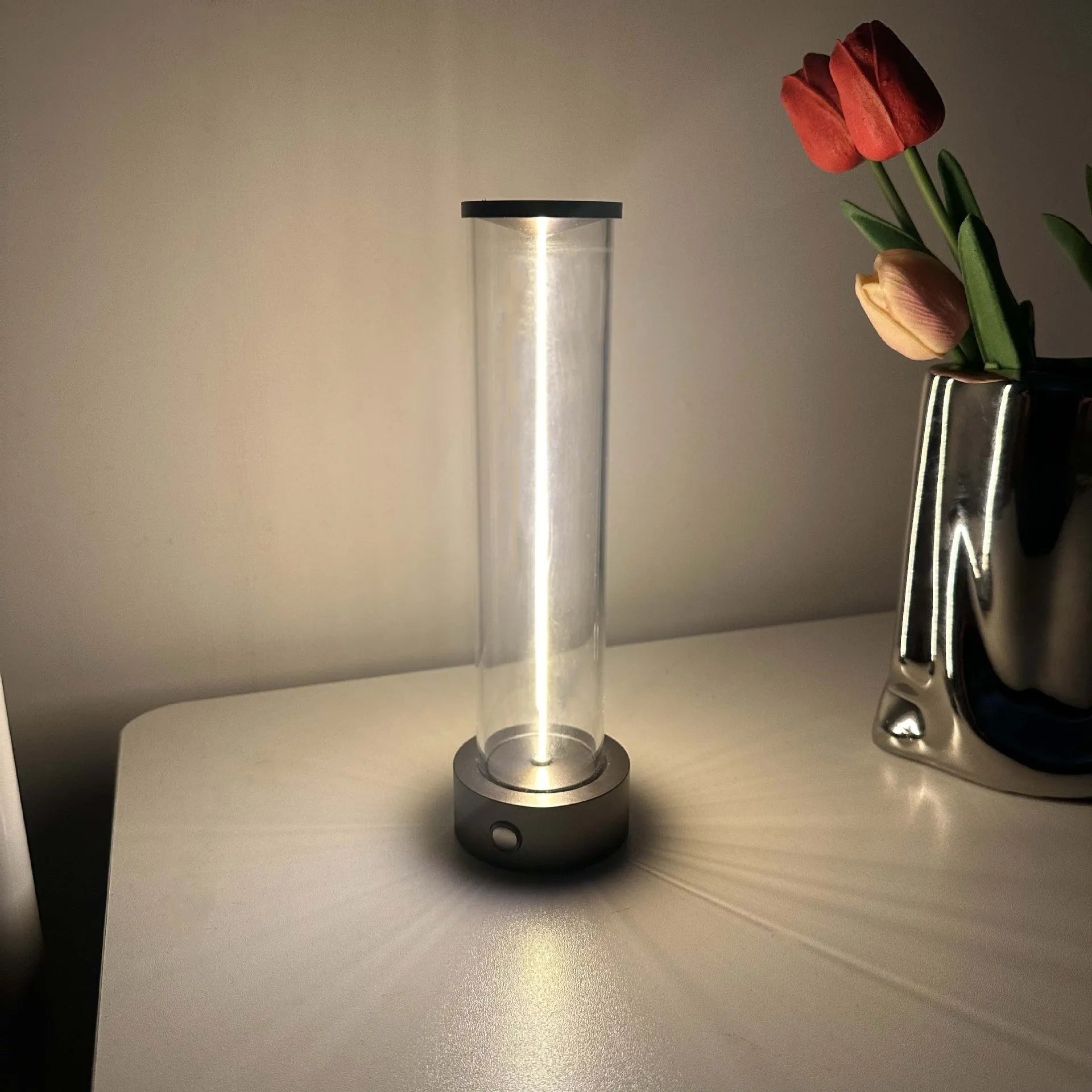 Slender white USB LED light strip with magnetic base on a metal surface