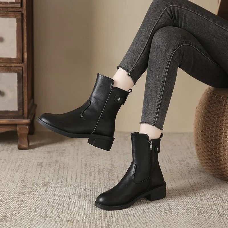 Black women's ankle boots with side zipper and low heel on round toe