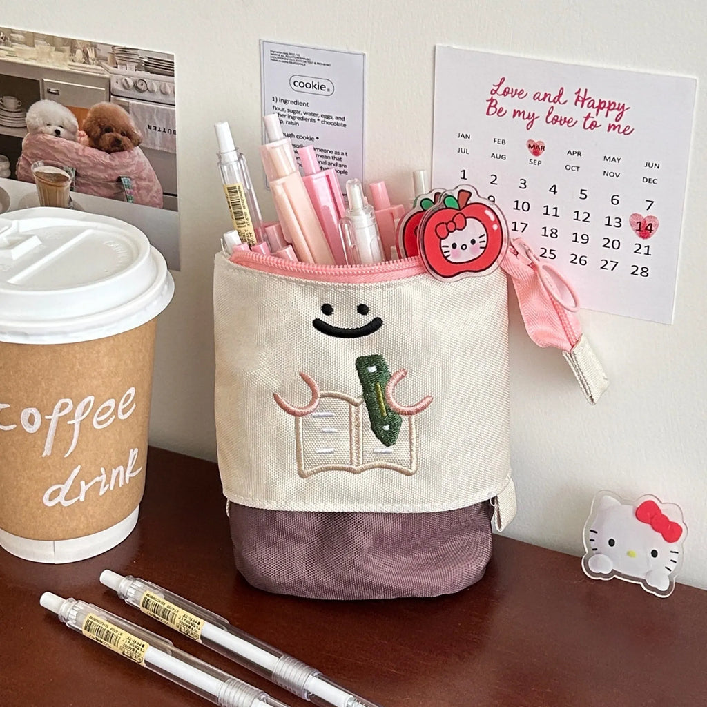 Brown collapsible Korean style cartoon print pencil case made from Oxford fabric.