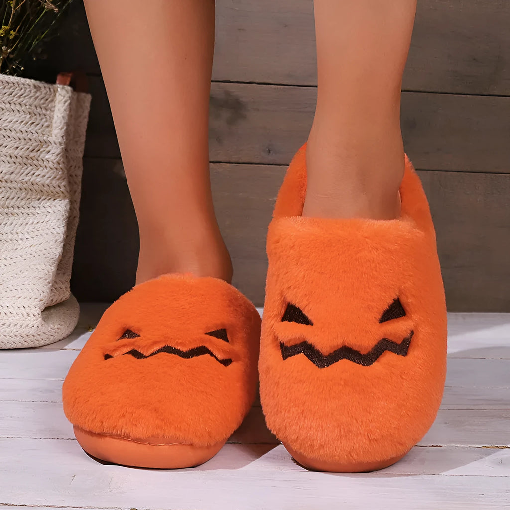 Orange Halloween pumpkin slippers with coral velvet exterior and plush lining
