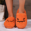 Orange Halloween pumpkin slippers with coral velvet exterior and plush lining