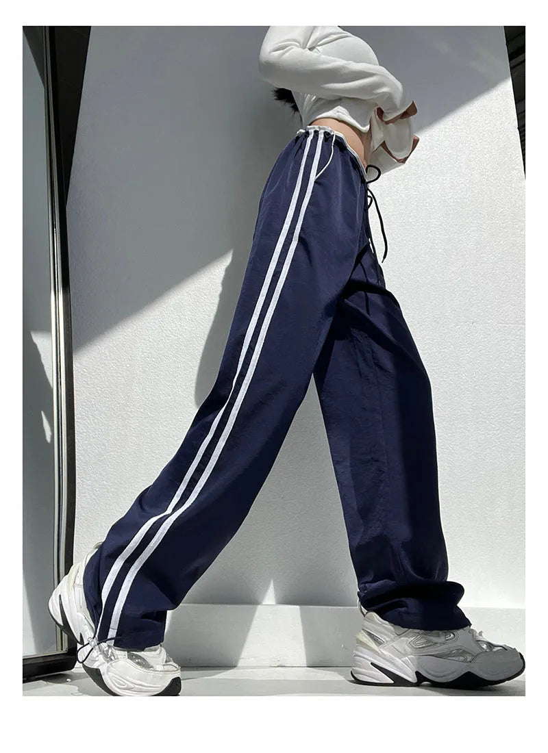 Women's navy blue trousers with white contrast ribbon parallel bar detailing, low-waist straight-leg design