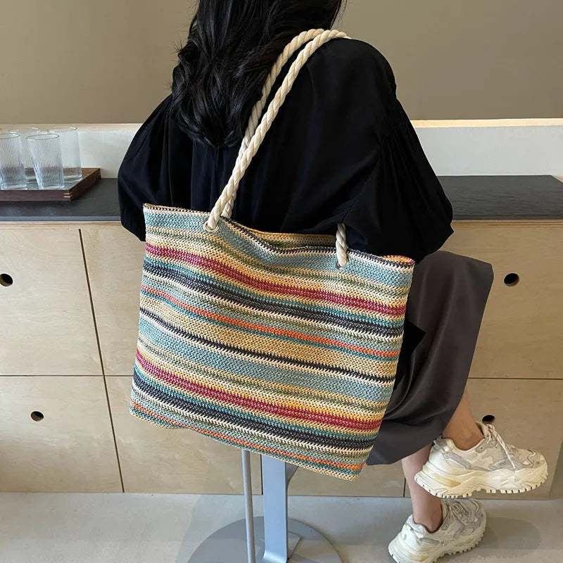 Blue straw woven large shoulder bag with an adjustable nylon strap