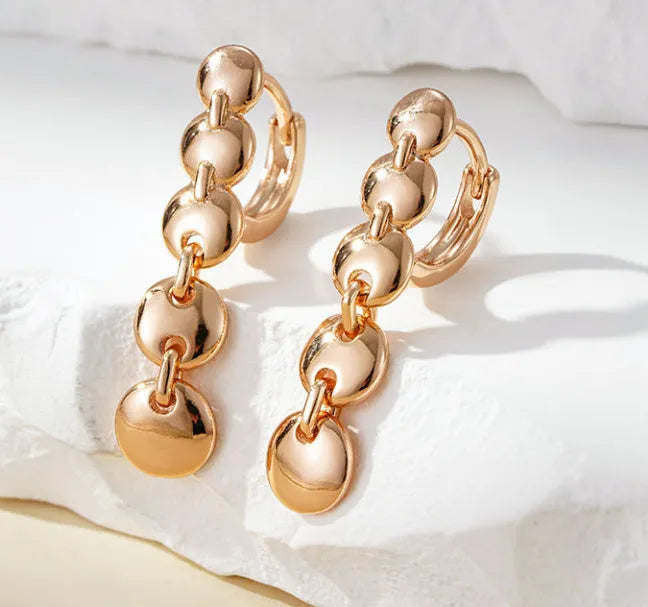 Retro gold tone woven copper circle drop earrings with vintage styling