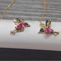 Long style hanging earrings featuring a bird design with mixed zirconium wings in red and blue electroplated alloy