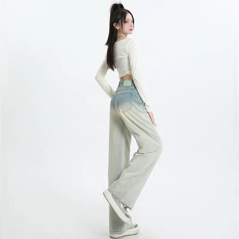 Women's gradient blue straight-leg denim trousers with wide leg design showing colour transition effect