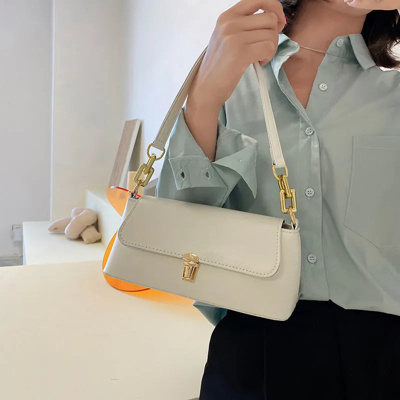 Brown French casual underarm bag with single shoulder chain, showing horizontal square shape and sandwich pocket design