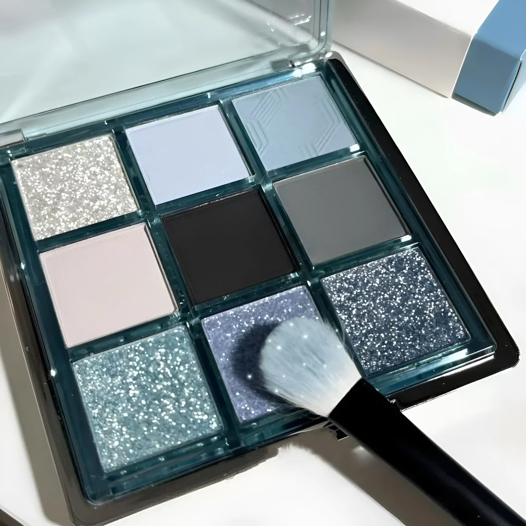 Nine-colour eye shadow palette with blue smoked shades showing matte and shimmer finishes