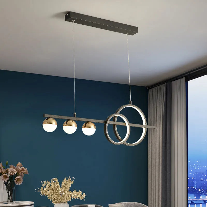 Modern rectangular aluminium ceiling light in black or gold with remote control for dimming.