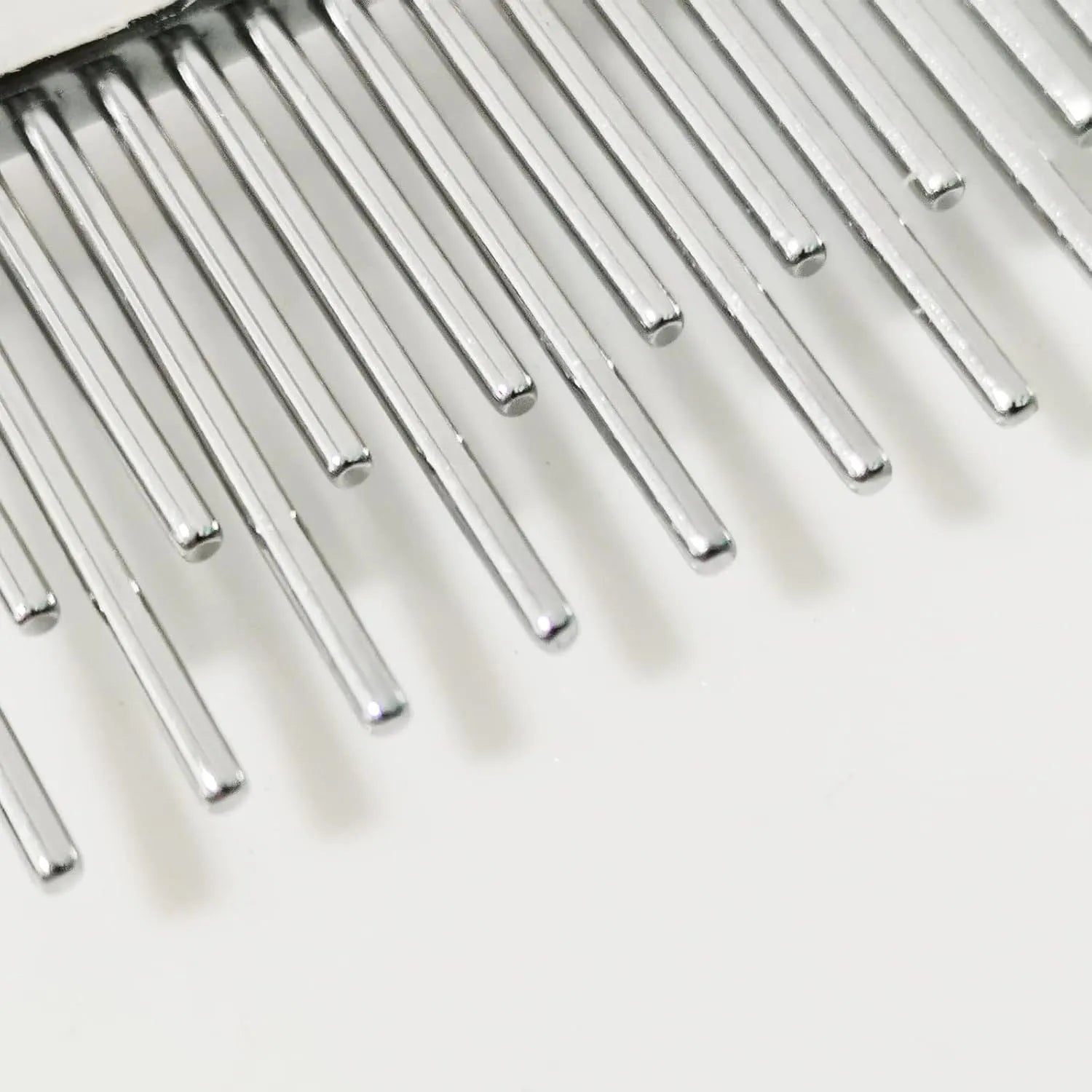 Red pet dematting comb with short and long stainless steel teeth and a plastic handle.