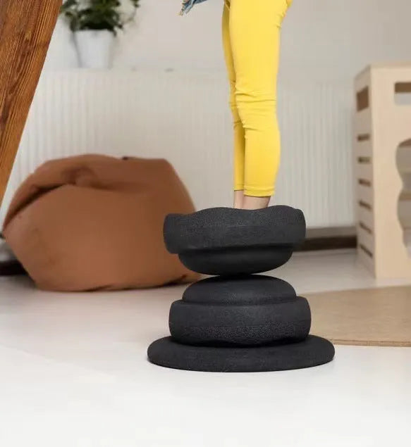 Plastic wood surf balance board for children in mixed colour or black wood effect finish.