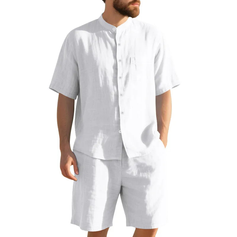Men's light blue linen blend summer suit with Henry collar shirt-style jacket and matching shorts on a hanger.