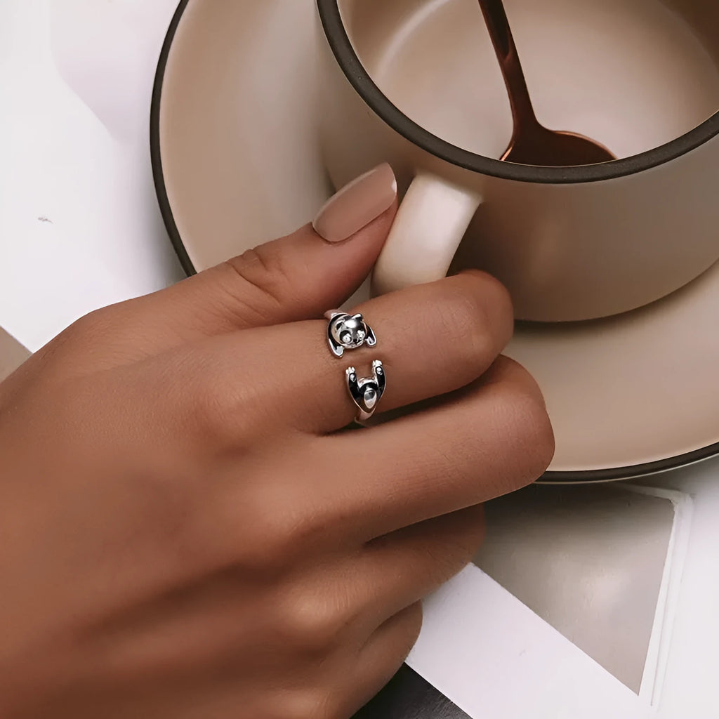 Adjustable sterling silver panda open ring with white gold plating, showing animal design and opening mechanism