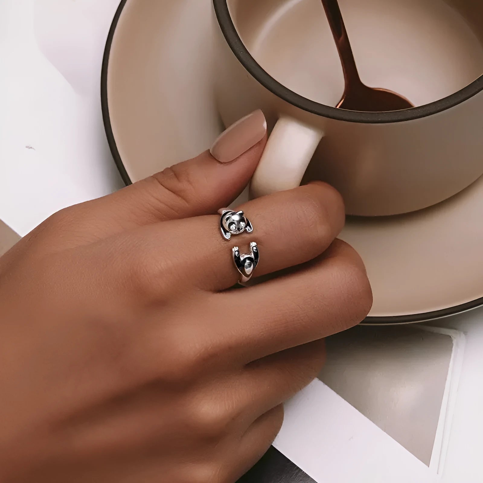 Adjustable sterling silver panda open ring with white gold plating, showing animal design and opening mechanism