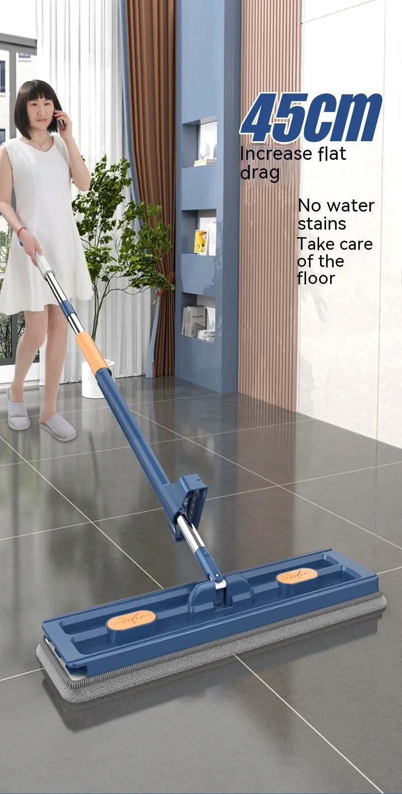 Large flat mop with stainless steel handle and 360-degree rotating head on hard floor