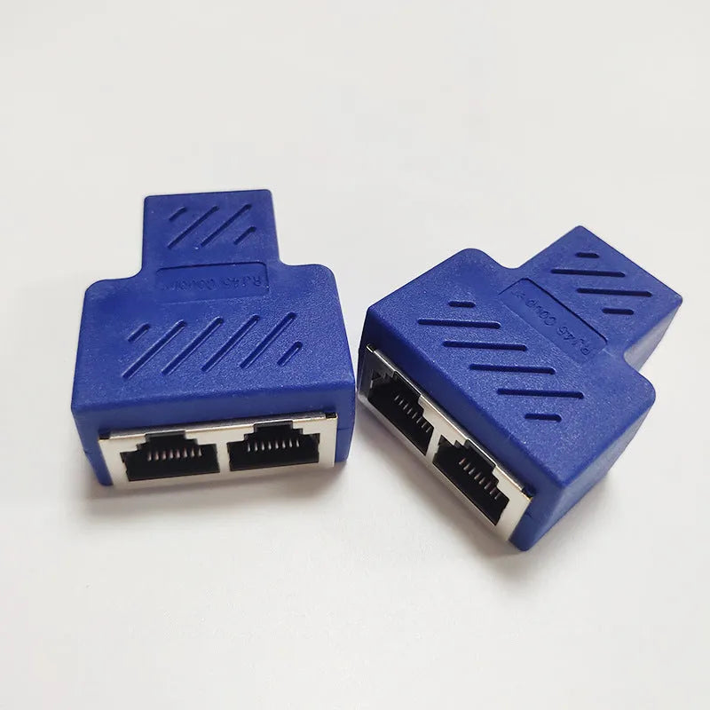 Two white RJ45 network cable splitter adapters showing three ports each.