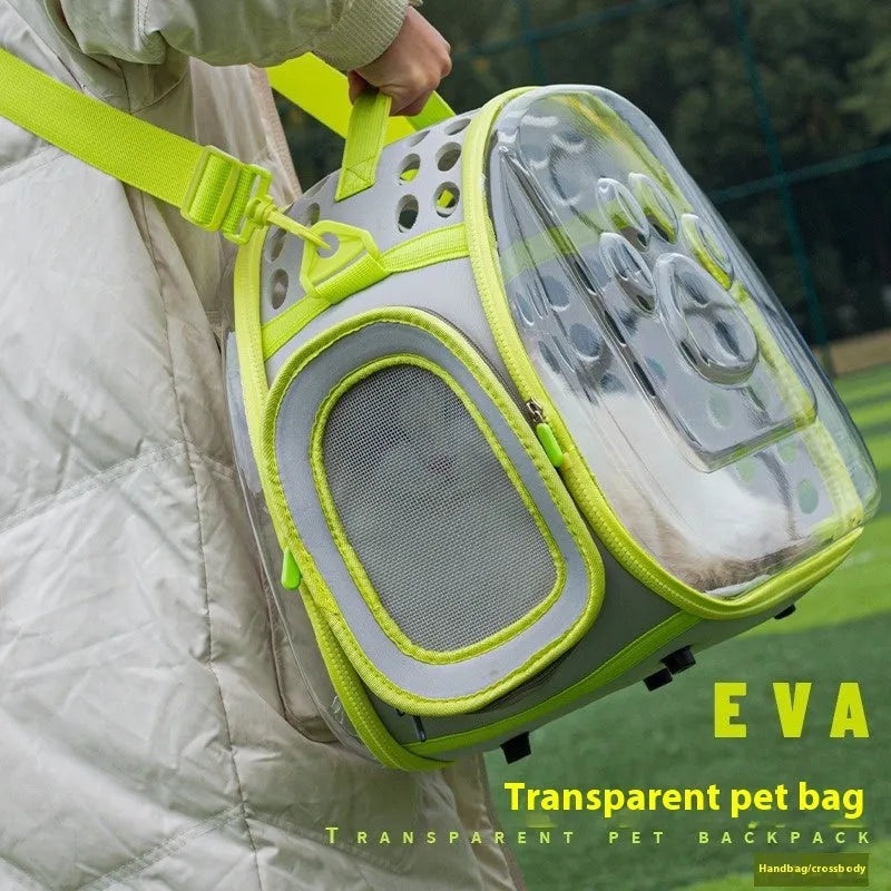 Transparent hard-shell space capsule backpack for a cat, shown in a choice of colours including grass green and pink.