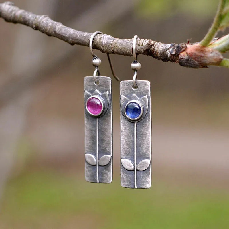 Geometric antique finish earrings with ellipse details and electroplated metal construction