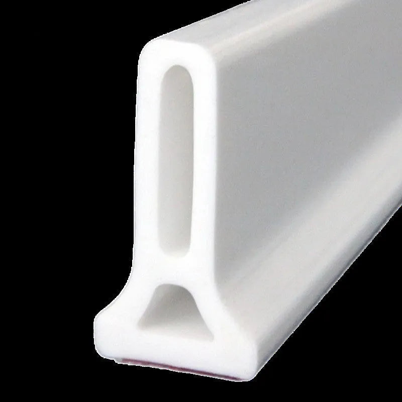 Flexible silicone bathroom waterproof strip in black colour showing water barrier installation