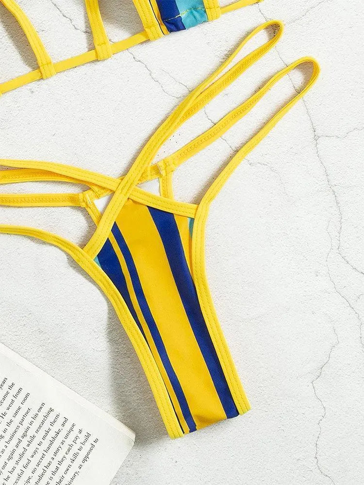 Yellow women's split swimsuit with neck-hanging style, backless hollow design, and high-waist shorts.
